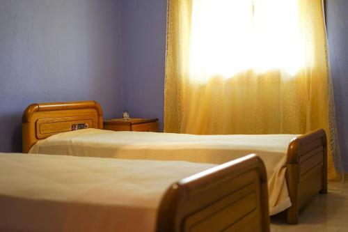 A bed or beds in a room at Traditional cozy residence in Lafkos, Pelion