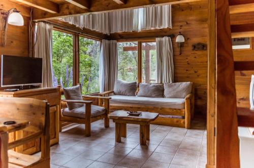 TV a/nebo společenská místnost v ubytování BOG Ocrehue - Cabanas