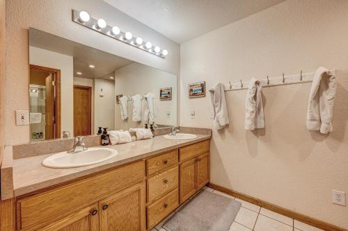 a bathroom with two sinks and a large mirror at Donner Lake House in Truckee