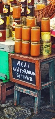 a table with jars of food on top of it at Anastasia's Suites Arcadia in Vytina