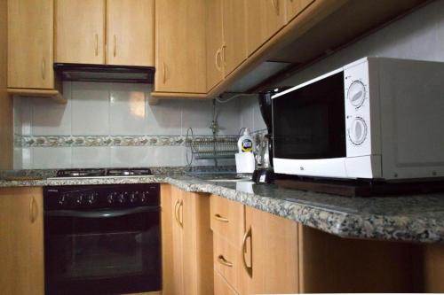 Kuchyň nebo kuchyňský kout v ubytování Apartamentos Gamela en Playa Canido - Vigo