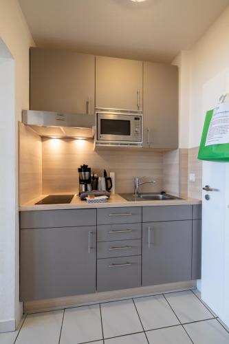 Dapur atau dapur kecil di Nordland Appartements - Wohnung Südfall