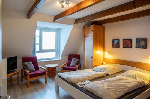 Ένα ή περισσότερα κρεβάτια σε δωμάτιο στο Nordland Appartements - Wohnung Samsö