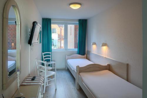 Ένα ή περισσότερα κρεβάτια σε δωμάτιο στο Nordland Appartements - Wohnung Seeland