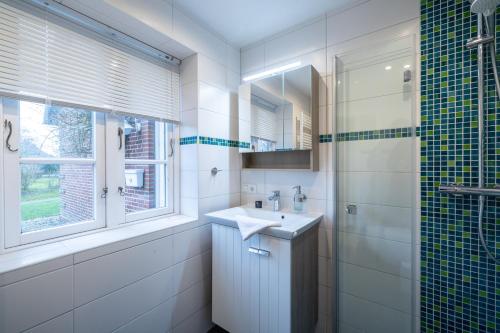 Ένα μπάνιο στο Ferienwohnung Goting