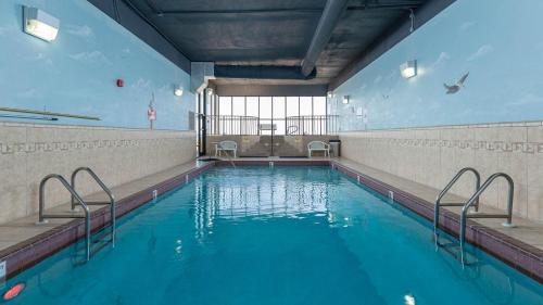 a swimming pool with blue water in a building at Apartment in Orange Beach