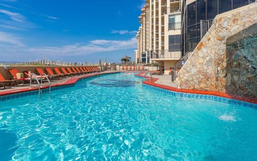 a large swimming pool on the side of a building at Apartment in Orange Beach