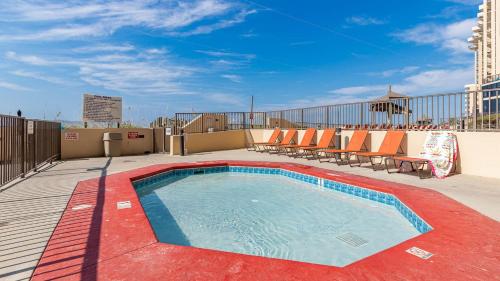 a swimming pool on the roof of a building at Apartment in Orange Beach