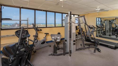 a gym with treadmills and exercise bikes in a room at Apartment in Orange Beach