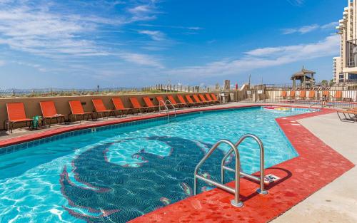 a large swimming pool on top of a building at Apartment in Orange Beach
