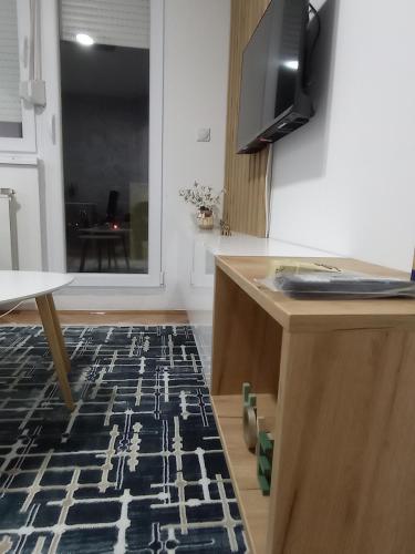 a kitchen with a black and white rug on the floor at STAN NA DAN BIJELJINA in Bijeljina