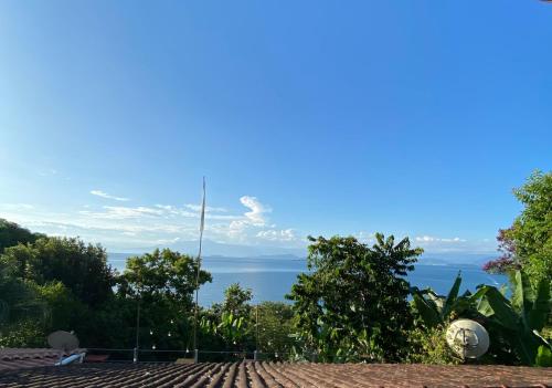 a view of the ocean from the roof of a house at Bem Natural Pousada in Praia de Araçatiba