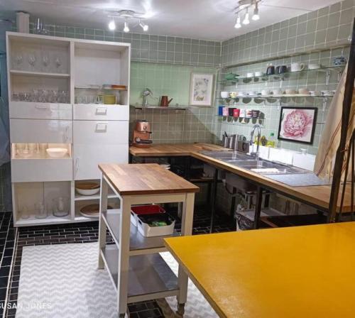 a kitchen with a refrigerator and a sink in it at Big Groups Heaven in Central Location in Bangkok