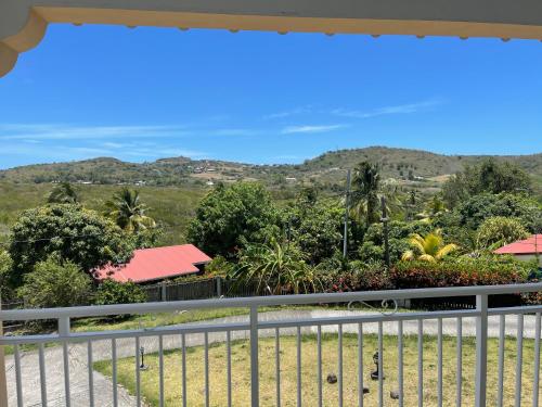 a view of the mountains from the balcony of a house at ALIZÉ CAP in Sainte-Anne