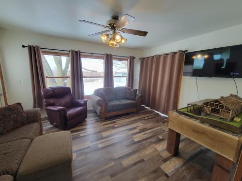 a living room with a couch and a table at Mallory Estate in Chariton