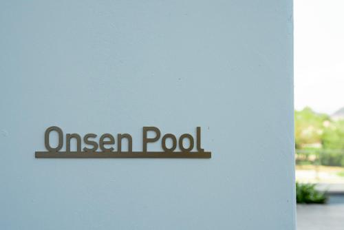 a sign on a wall that reads queen pool at Ipoh Tambun Lost World Sunway Onsen Suites Lana 2R2B 8 paxs in Tambun