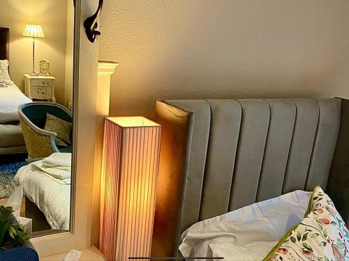 a room with a radiator and a mirror at Bird In Bush Elsdon in Elsdon