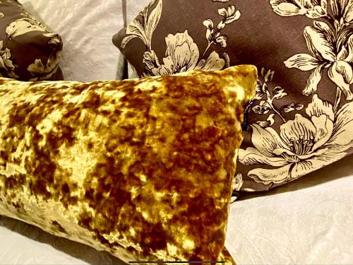 a tortilla laying on a bed next to a pillow at Bird In Bush Elsdon in Elsdon