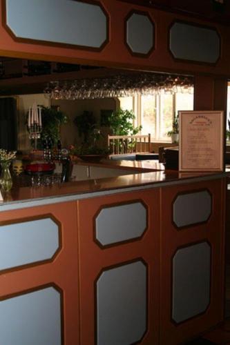 a bar with a wooden counter top in a restaurant at Lagadalens Värdshus in Lagan