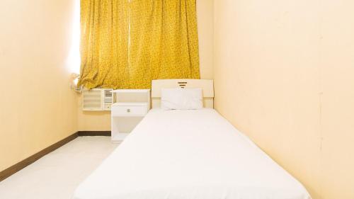 Een bed of bedden in een kamer bij Waterfun Condominium Hostel