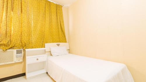 Uma cama ou camas num quarto em Waterfun Condominium Hostel
