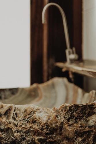 a close up of a bathroom sink with a faucet at BOA BOA Bacalar in Bacalar
