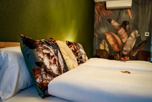 a close up of a bed in a room at Hotel-Residenz-Luxury-Apartments in Metzingen