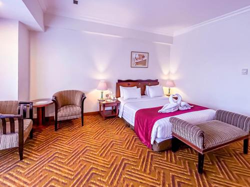 Katil atau katil-katil dalam bilik di Planet Holiday Hotel & Residence
