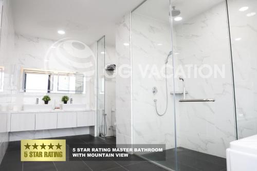 a bathroom with a shower and a sink at Lovely 3-bedrooms with Karaoke Genting Penthouse in Genting Highlands