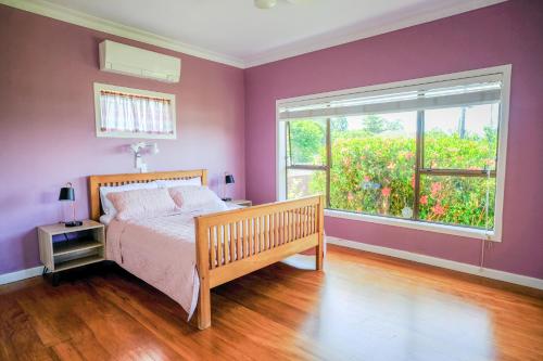 Ένα ή περισσότερα κρεβάτια σε δωμάτιο στο Auckland Howick Sea View House