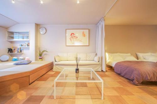 Postel nebo postele na pokoji v ubytování d3 HOTEL+Gallery 2 & 3