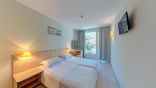 Letto o letti in una camera di Madara Park Hotel - All Inclusive or BB