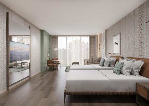 een slaapkamer met een groot bed en een woonkamer bij Gloria Serenity Resort in Belek