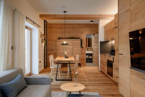 a living room with a table and a couch at Vila Pavlina in Kranjska Gora