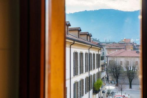a view of a city from a window of a building at Apartment Piazza Roma by Quokka 360 - historic flat in the centre of Como in Como