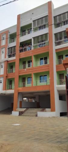 an apartment building with balconies on the side of it at MEGA HOME in Bhubaneshwar