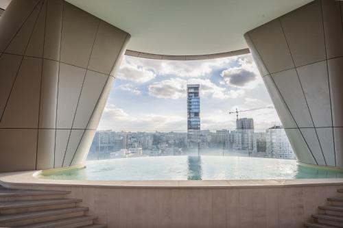 a view from the top of a building with a swimming pool at 360 Nicosia - Luxury Apartment Panoramic View in Nicosia