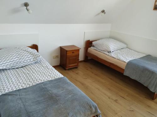 En eller flere senge i et værelse på Domek Całoroczny, 15km od Zakopanego