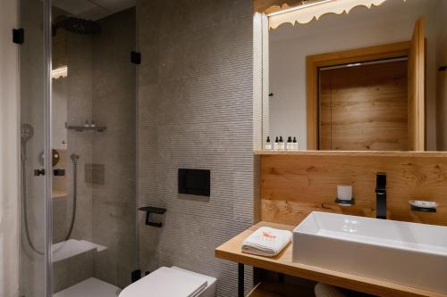 a bathroom with a sink and a toilet and a shower at Vila Pavlina in Kranjska Gora