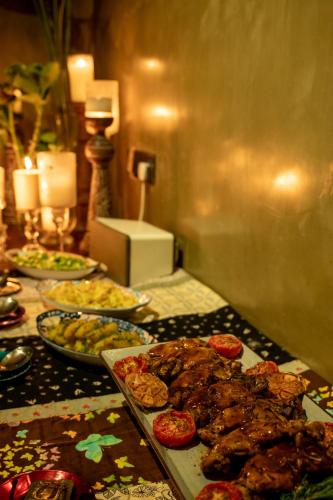 a table with many plates of food on it at Tranquil Waters in Negombo