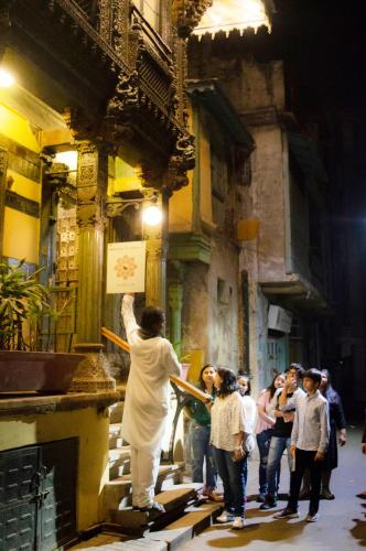 a group of people standing outside of a building at The House of MG-A Heritage Hotel, Ahmedabad in Ahmedabad
