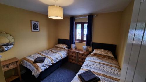 Katil atau katil-katil dalam bilik di Chestnut Lodge, Summerhayes