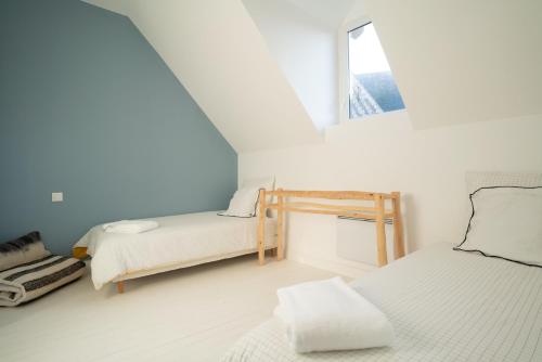 Katil atau katil-katil dalam bilik di Maison Cachée - Chambres et Appartements en Baie de Somme