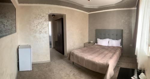 Postel nebo postele na pokoji v ubytování Hotel MARUNA