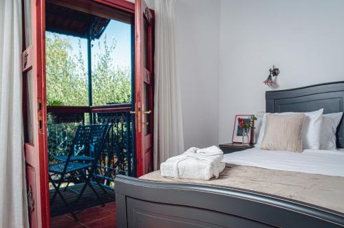 a bedroom with a bed and a sliding glass door at וילה תהילה המחודש - The new Villa Tehila in Rosh Pinna