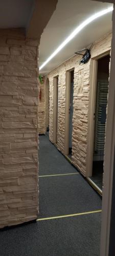 an empty hallway of a building with wooden walls at ZAJAZD ALBATROS Rzeszów SPA in Rzeszów