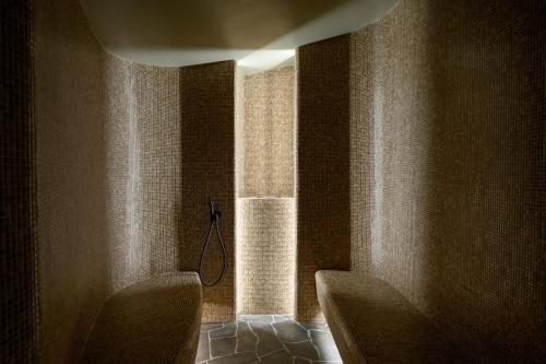 a bathroom with two chairs and a window at Vila Pavlina in Kranjska Gora