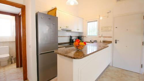 Kuchyň nebo kuchyňský kout v ubytování Residencial El Cortijo