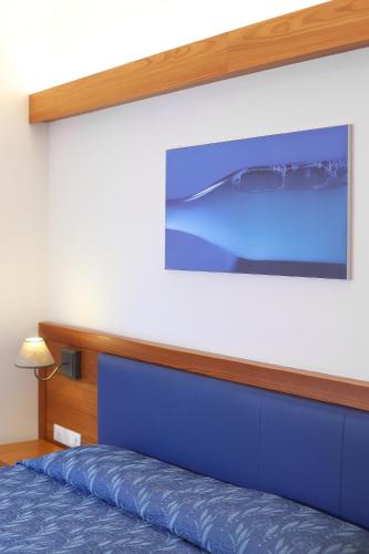Ένα ή περισσότερα κρεβάτια σε δωμάτιο στο Agritur Ponte Alto