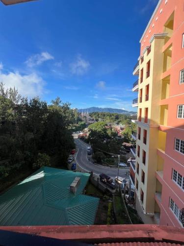 a view of a street from a building with a green roof at 88Minesview LODGE By SUNTRUST CONDOMINIUM in Baguio